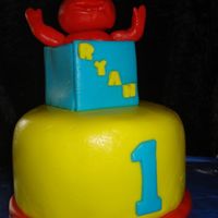 Nephew's 1St Birthday Made this as a smash cake for my nephew, everyone else is getting walmart cupcakes (gross). First time making fondant figure of anything......