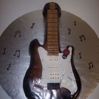 Guitar With Ladybug This is a chocolate fudge groom's cake that I made for a rehearsal dinner. The guitar is a replica of the groom's guitar (she...