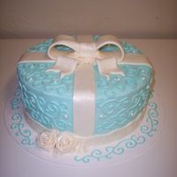 Tiffany_Retirement_Party.jpg This cake was made for a retirement party. Decorated with buttercream frosting, fondant bow & royal icing roses.