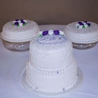 First Wedding Cake Red Velvet w/Cream Cheese Filling, Satin Ice Fondant w/Luster Spray, Amethyst colored Dragees, Royal Icing Monogram letters.