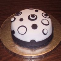 Circle Madness !!! White Fondant with black and white fondant cutouts.