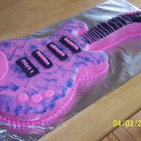 Hannah Montana Guitar Cake Guitar base was cut with a template using a 11 x 15 cake; neck was made with a 9 x 13 cake. Covered with rolled fondant and sponged with...