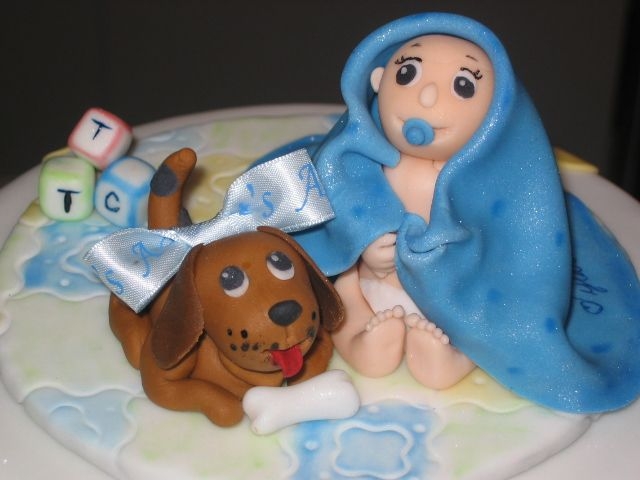 Tylar My first 3D figures, all made out of fondant. I love the baby's toes! T.T.C the babies initials on the blocks and I personalized it by...