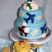 Airplane Cake Carrot Cake filled with cream cheese, covered in MMF and buttercream clouds.