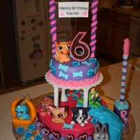 Littlest Pet Shop Cake My nieces Littlest Pet Shop cake.... the Pets are sculpted out of rice krispies, covered in fondant with hand painted faces, slide is rice...