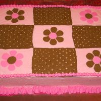 Pink & Brown Chocolate cake with buttercream icing. It was decorated by request to look like the baby's bedding.