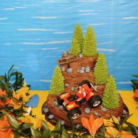Awesome! Magical! Sweet! Cake Contest! This cake is covered with a ton of chocolate buttercream. The trees are handpiped from gumpaste on ice cream cones. Rocks are made from...