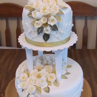 Awesome! Magical! Sweet! Cake Contest! Cake is covered with fondant. Roses are made with fondant and dusted with gold shimmer dust. Leaves are not edible.