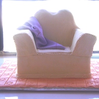 Sofa Set Retirement Cake A client of mine ordered this for his mother's retirement suprise. The purple 'throw" is made using fondant.