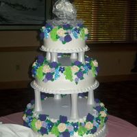 Wedding Cake 16", 12" and 8" round cakes iced with white buttercream and decorated with Royal Icing flowers!