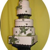 Green Flower Wedding Cake This was inspired by a flowered table cloth. All the decorations are made of fondant and edible. The stand which is made of sugar was...