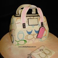 Coach Purse Cake This one was for an older lady who always wanted a coach purse, I do believe she got the real thing too