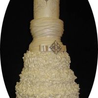 Wedding Dress Cake This cake has a mixture of 3 wedding dress elements. The bottom of it is from a dress that had many ruffles, the center part is a dress...