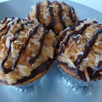 Chococaramelcoco Cupcakes Ganache, Homemade Caramel, and Toasted Coconut on top of a yummy Cupcake