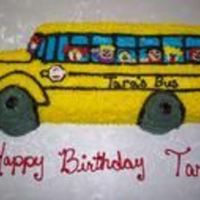 3-D School Bus This is the noraml school bus pan that is all star tipped wtih butter cream icing and then I added Butter cream people in the windows.