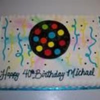 Disco Party This is a sprayed back ground and a pipped on disco ball that matched the one him and his son made. This cake is all butter cream icing.