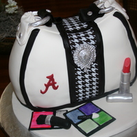Alabama Purse Chocolate cake 3 layers high iced and filled with light cocoa buttercream; carved in the shape of a purse, then crumbcoated again; chilled...