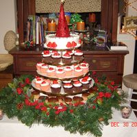 Xmas Wedding Cupcake Tree Cupcake tree made for reception. All cupcakes iced in BC with molded chocolate hearts on top. Top cake is lemon.