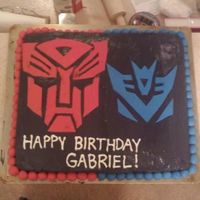 Transformers.jpg Made this for my brother's birthday. First time I really used fondant! It was two cakes, one chocolate chip and the other one was just...