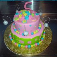 5 Year Olds Birthday i got asked to make this cake, as told it had to be two cakes, pink and disco themed. also with the number and the flowers at the top. i...