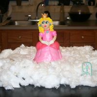 Princess Peach Princess Peach (from the Super Mario Bros games) is made out of rice krispie treats and fondant. Surrounding her is simply cup cakes...