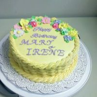Birthday Cake 8" round yellow basketweave with royal icing flowers. This is a yellow cake with almond flavored frosting and filling. I made this for...