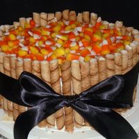 Halloween! Candy corn and Piroline cookies on top of Pumpkin spice cake w/ vanilla BC. Tied with black ribbon.