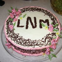 Engagement Cake A chocolate cake with a whipped frosting and melted chocoate deco.
