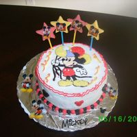 Mickey Mouse This is my first attempt at a birthday cake let alone a character cake the black bleed some hopefully my next attempt will come out cleaner...