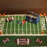 Football 1St Birthday Cake 1st birthday party with a football theme. All footballs are fondant, the cooler is gumpaste. The ice in the cooler was made with isomalt.