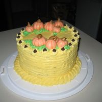 Pumpkin Patch A two layer yellow cake I made for my animation class for our Halloween party. I made the pumpkins out of fondant.