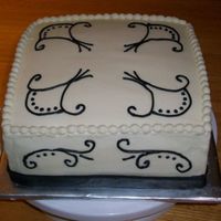Black And White Scroll Cake White cake, fresh strawberry filling, white chocolate icing. First attempt at scroll work.