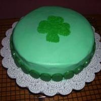 St. Patricks Day Cake Chocolate cake, bc, candy melts for the border. I used a cookie cutter for the shamrock in the center. Very novice baker! Still learning...