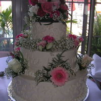 White Wedding Cake I made this cake for a friends wedding. It is vanilla cake with vanilla butter cream. (14", 10", 6")The florist made the...