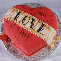 Heart Tattoo Choc fudge with vanilla bc under fondant...fluffy choc bc filling.Banner fondant