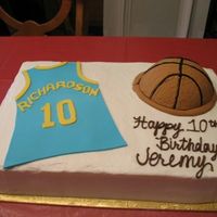 Jeremy's Basketball Cake For my nephew's 10th Birthday. Chocolate cake with cookies and cream filling, buttercream icing. The basketball is cake covered in...
