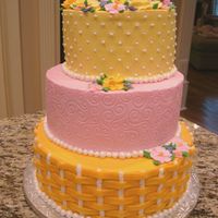 Citrus Tired Cake This was a cake we did for our end of the course of Wilton. The bottom later is a 16" round in orange pound cake with a basketweave...