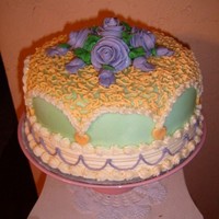 Wedding Style Fondant And Buttercream Fondant based iced with buttercream decorations.