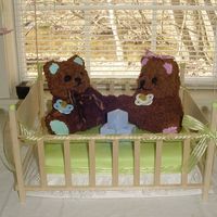 Bears In A Crib My neice is expecting twins (a boy and girl) in about a month. I made this for her baby shower. Two Bears in a baby crib. I used chocolate...