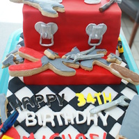 Tool Box Butter cake with mint chocolate chip filling. Used the chocolate ganache method and fondant, decorations are fondant, gum paste, &...