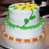 Sunflowers 2 teirs of chocolate chip cake w/ chocolate chip cookie dough mousse filling(eggless cookie dough folded into whipped cream) and covered in...