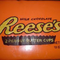 Reese's Cake Reese's cake. Chocolate cake with peanut butter buttercream. The logo is a CT.