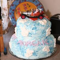 Chitty Chitty Bang Bang I stacked two round cakes and covered with colored whipped cream to give the cake a fluffy cloud look (using blue for sky and white for...