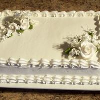 Bridal Shower Cake Used decopac royal icing bouquets. White cake and white icing.