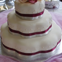Wedding Cake Ivory petal shape with burgundy and pink ribbon topper and ribbons