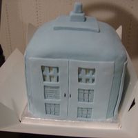 Dr Who's Tardis Sponge cakes stacked and covered with fondant decorated to resemble the Tardis. Colour not correct blue
