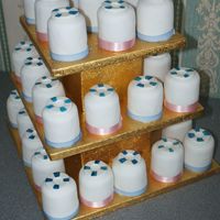 Life Saver Plain mini cakes fondant covered with life belt as topper to match wedding cake.