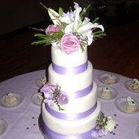 White Fondant With Lavendar Ribbon White chocolate cake and lemon poppy seed alternating with lemon curd filling. I used meringue butter cream with creme bouquet flavoring...