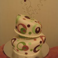 Topsy Turvy Birthday Teen birthday cake. Chocolate raspberry cake covered in fondant; used styrofoam lift in center.
