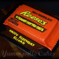 Reeses Peanut Butter Cup Cake 2 layer 9X13 chocolate cake with peanut butter fluff and reeses pb cup filling, covered and decorated with fondant.